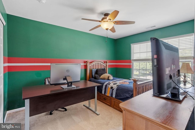 carpeted bedroom featuring visible vents and a ceiling fan