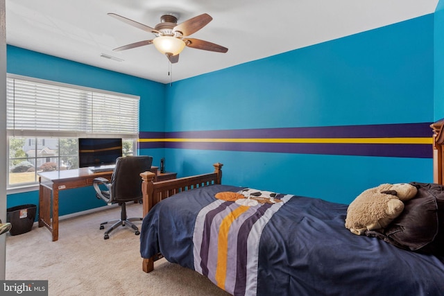 bedroom with carpet flooring, visible vents, and a ceiling fan