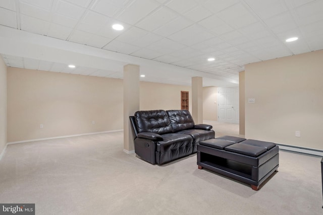 carpeted living area featuring baseboards and recessed lighting