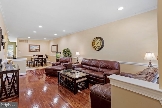 living area featuring dark wood-style floors, recessed lighting, visible vents, and crown molding