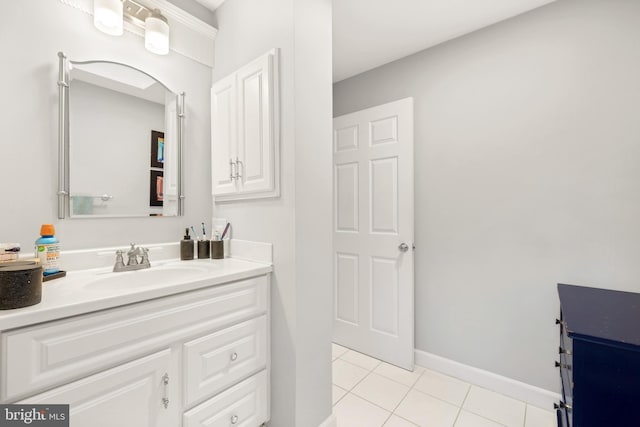 bathroom featuring tile patterned flooring, vanity, and baseboards