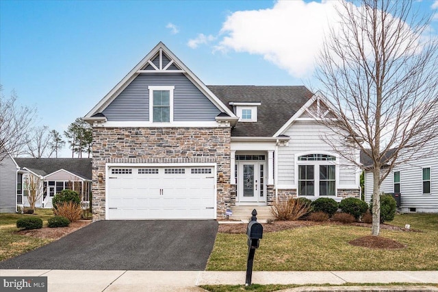 craftsman house featuring aphalt driveway, stone siding, roof with shingles, and a front lawn