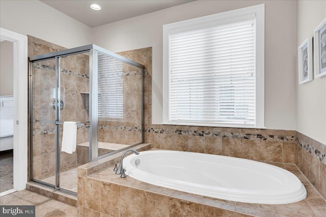 full bathroom with a stall shower, tile patterned floors, and a bath