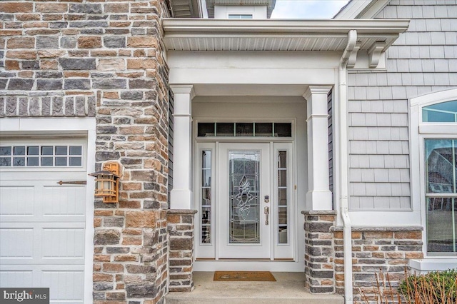 doorway to property featuring stone siding