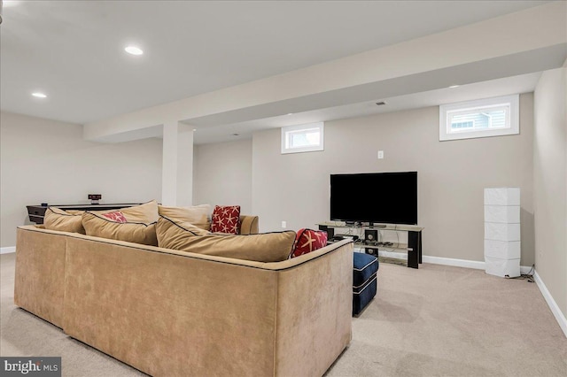 living room with recessed lighting, baseboards, and light colored carpet