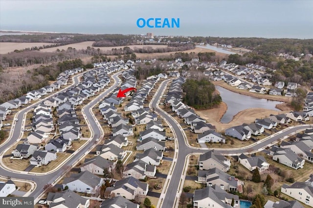 aerial view featuring a residential view and a water view