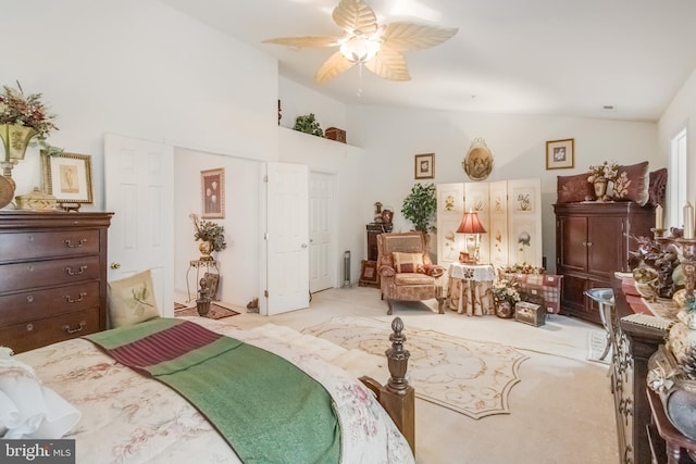 bedroom featuring carpet floors, high vaulted ceiling, and a ceiling fan