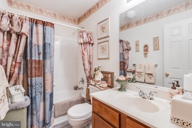 bathroom featuring toilet, vanity, and shower / bathtub combination with curtain