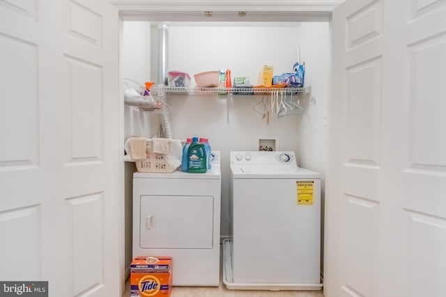 clothes washing area with laundry area and separate washer and dryer