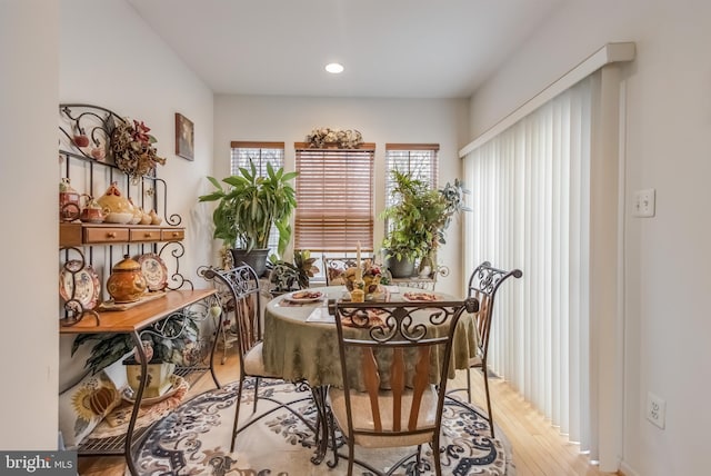 dining room featuring light wood-type flooring and recessed lighting