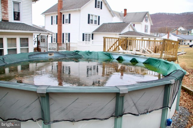 view of pool featuring a wooden deck