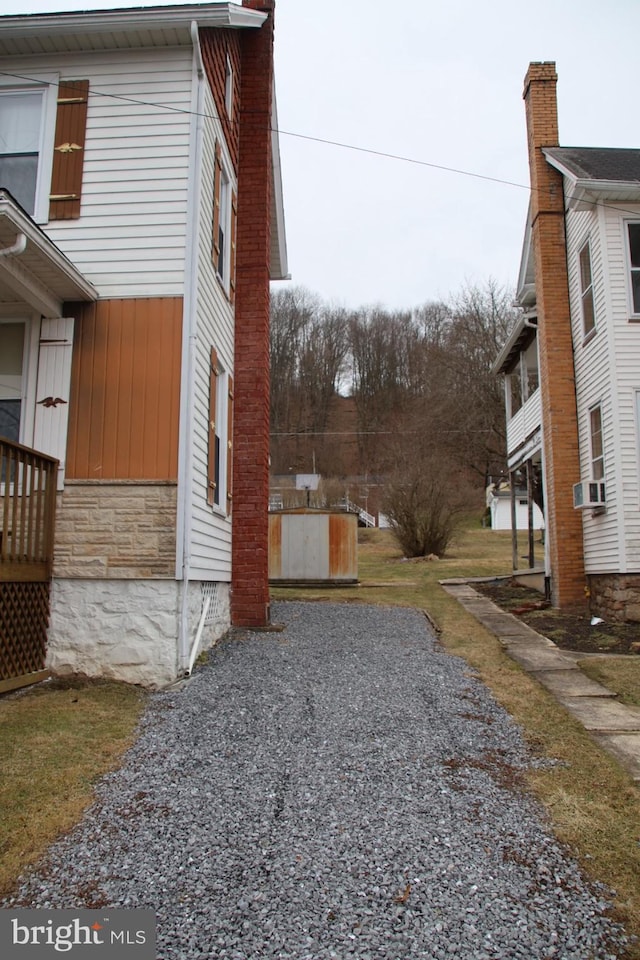 view of side of property with stone siding