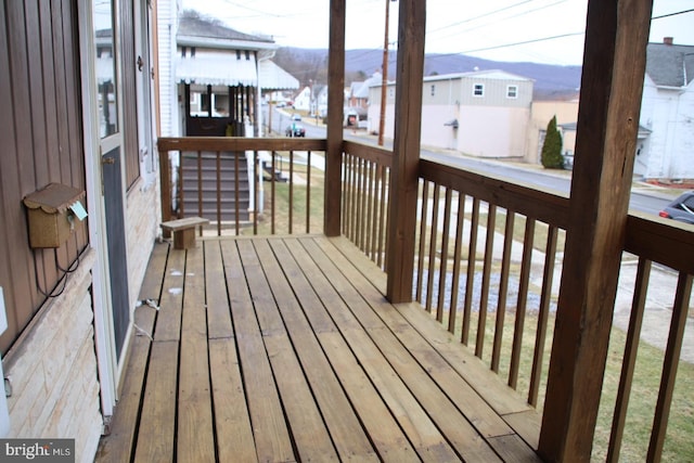 wooden terrace with a residential view