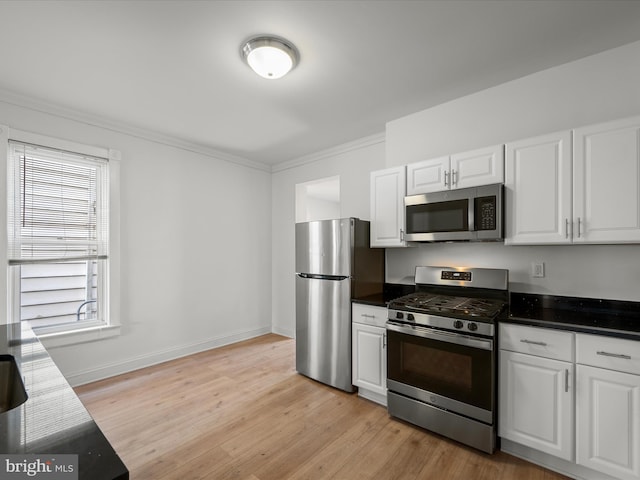 kitchen featuring light wood-style flooring, white cabinetry, and stainless steel appliances