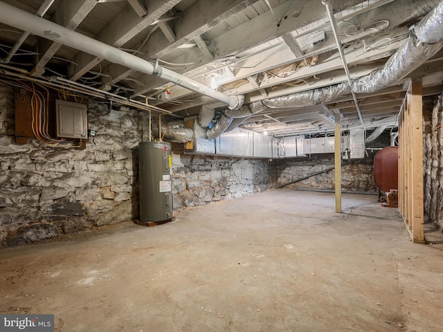 unfinished basement with water heater and heating fuel