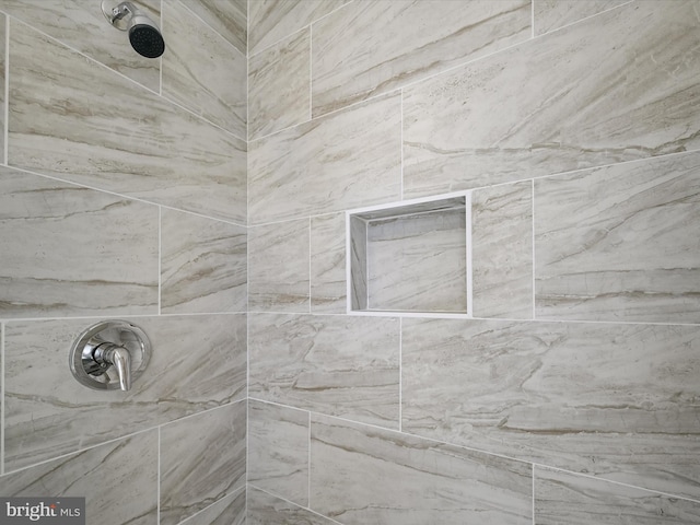 details featuring tiled shower