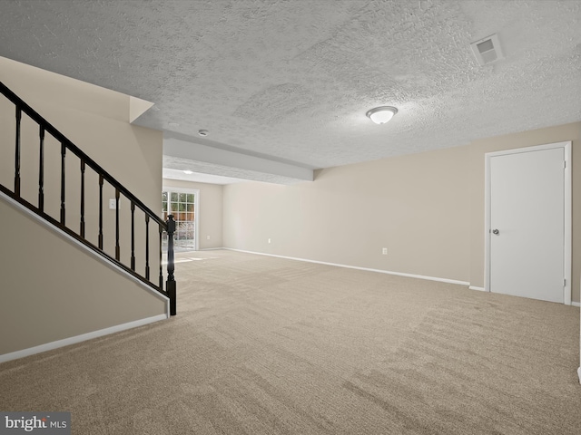 below grade area featuring stairway, baseboards, and carpet