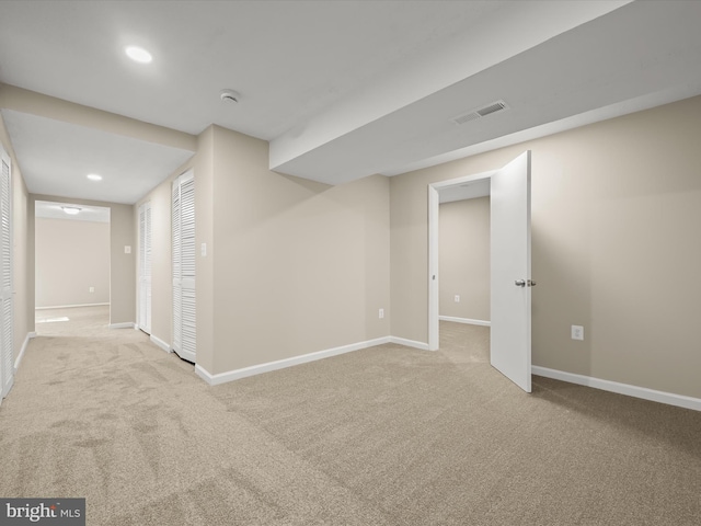 finished basement with recessed lighting, visible vents, baseboards, and carpet flooring