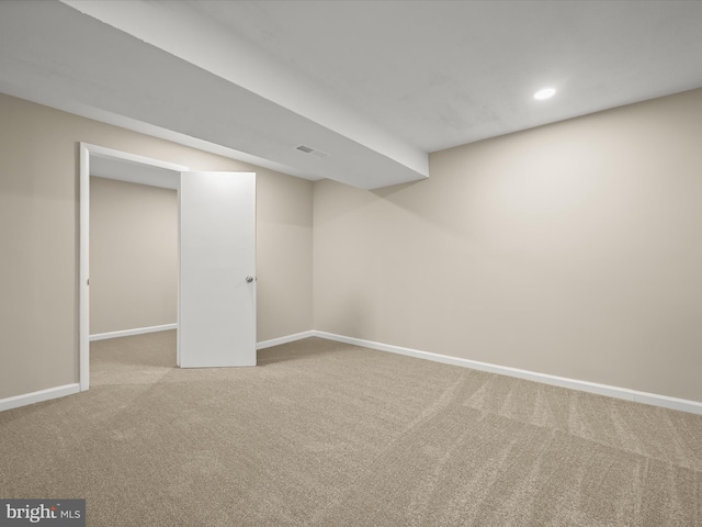 finished basement with visible vents, recessed lighting, carpet, and baseboards