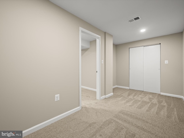 unfurnished bedroom featuring visible vents, baseboards, carpet flooring, recessed lighting, and a closet