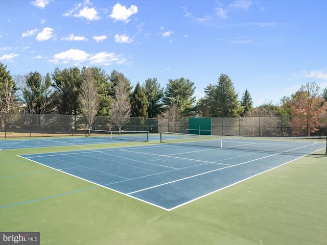 view of sport court with fence