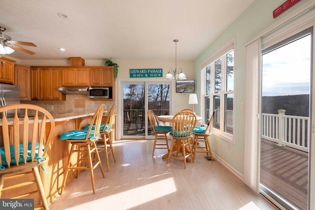 dining room featuring a chandelier, recessed lighting, visible vents, baseboards, and light wood-type flooring