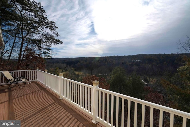 wooden terrace with a forest view