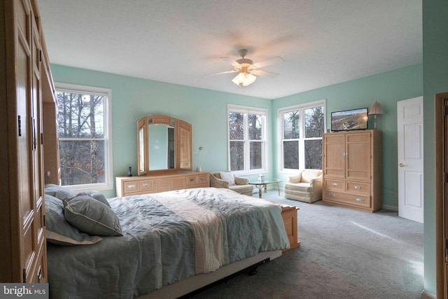 carpeted bedroom with a ceiling fan