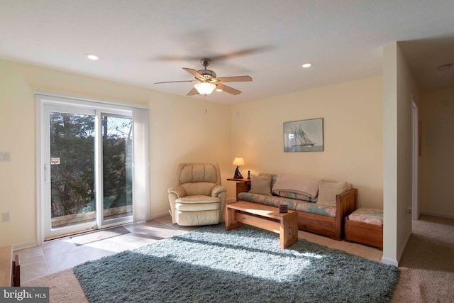 living area with a ceiling fan, recessed lighting, and baseboards