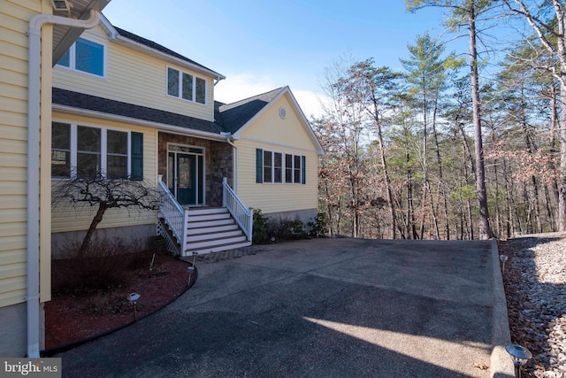 view of front of home featuring stone siding