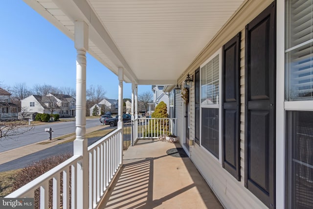 balcony featuring a residential view and a porch