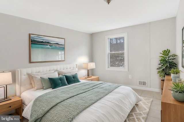 bedroom with visible vents and light tile patterned flooring