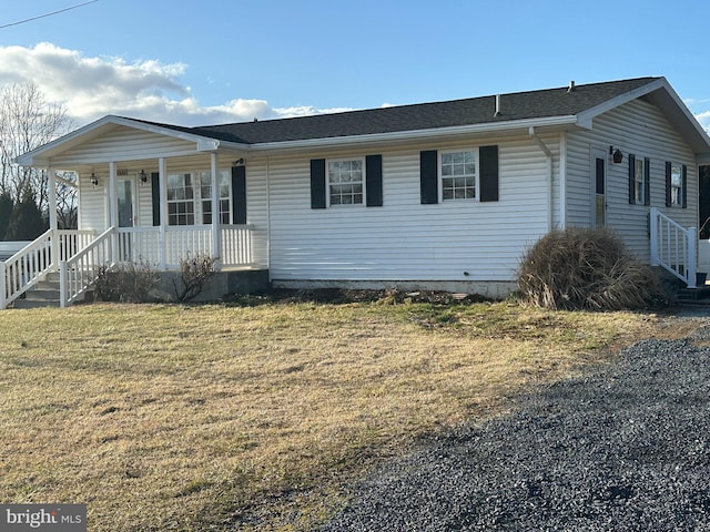 single story home with covered porch and a front lawn