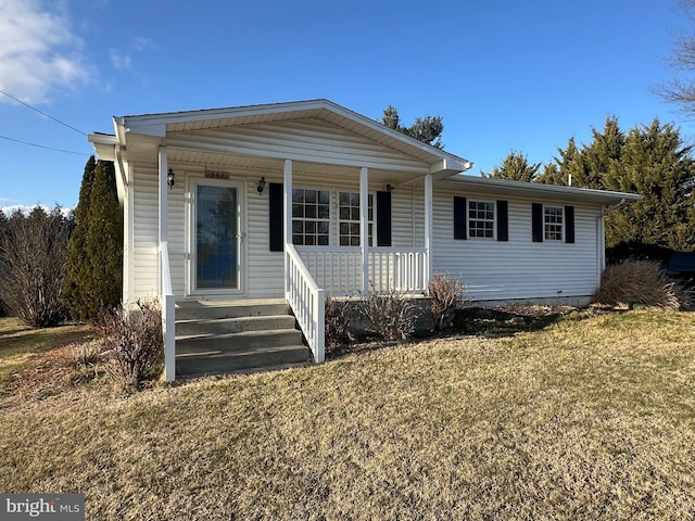 single story home featuring a front yard and covered porch