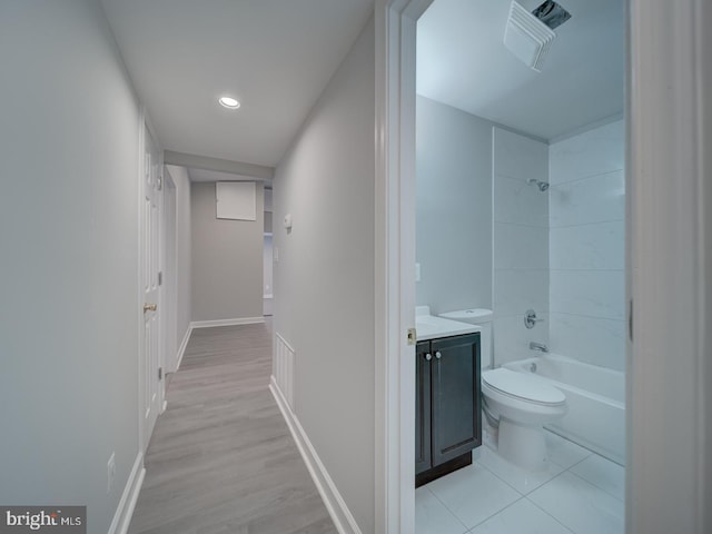 interior space featuring recessed lighting, baseboards, and light wood-style flooring