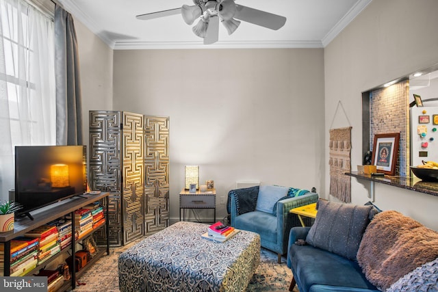 living room featuring ceiling fan and ornamental molding