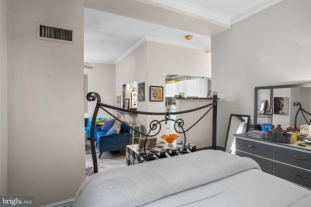 bedroom featuring visible vents, baseboards, and ornamental molding