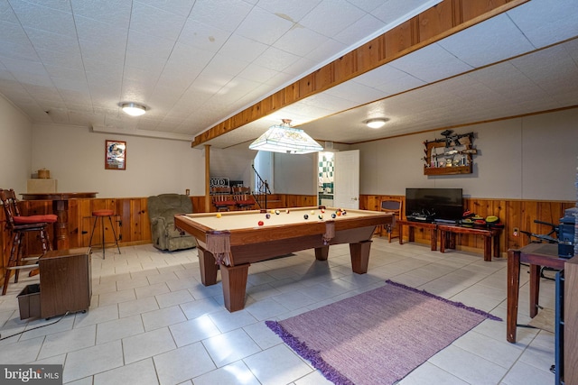 playroom with pool table, wood walls, and wainscoting