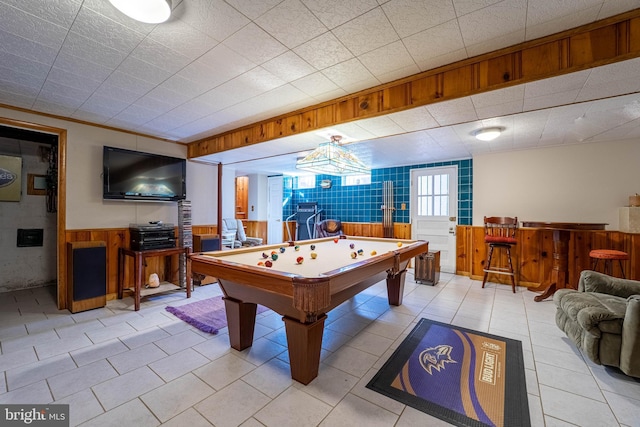 playroom featuring a wainscoted wall, billiards, and light tile patterned flooring