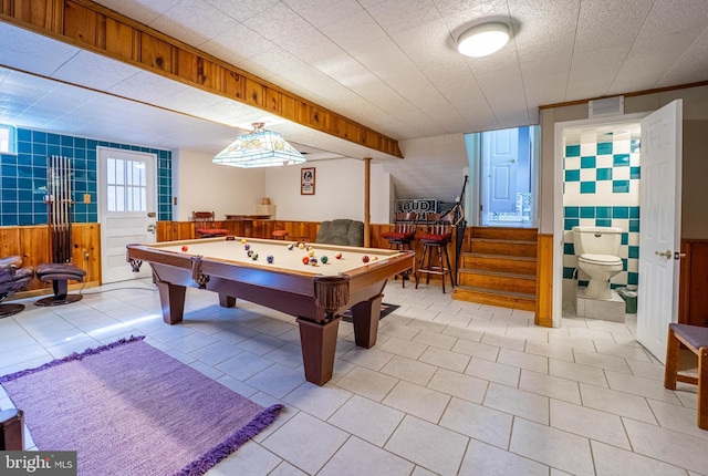 game room featuring pool table, a wainscoted wall, visible vents, and light tile patterned floors