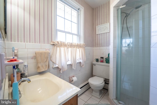 bathroom with toilet, tile walls, tile patterned floors, a stall shower, and wallpapered walls