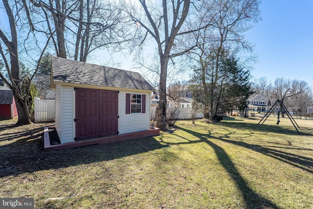 view of shed with fence