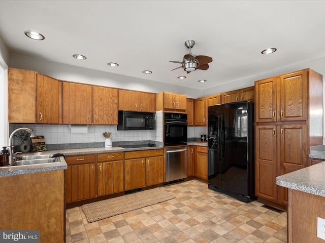 kitchen with backsplash, black appliances, brown cabinets, ceiling fan, and a sink