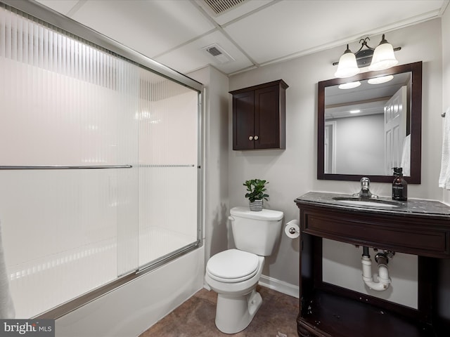 bathroom featuring shower / bath combination with glass door, baseboards, toilet, visible vents, and a sink