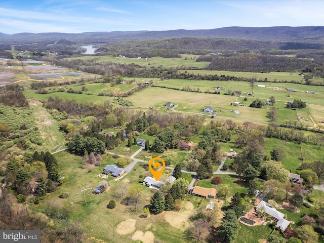drone / aerial view featuring a mountain view and a rural view
