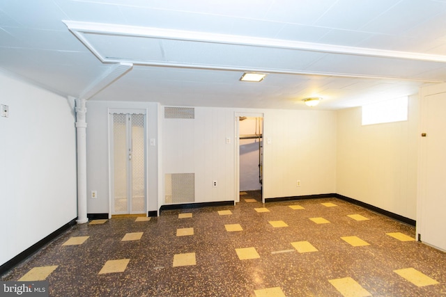 basement featuring visible vents and baseboards