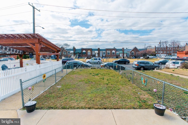 view of yard featuring a fenced backyard and a pergola