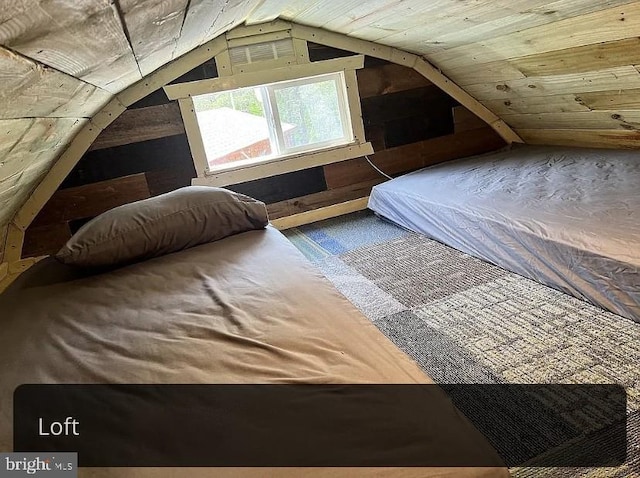 bedroom with lofted ceiling and wood ceiling