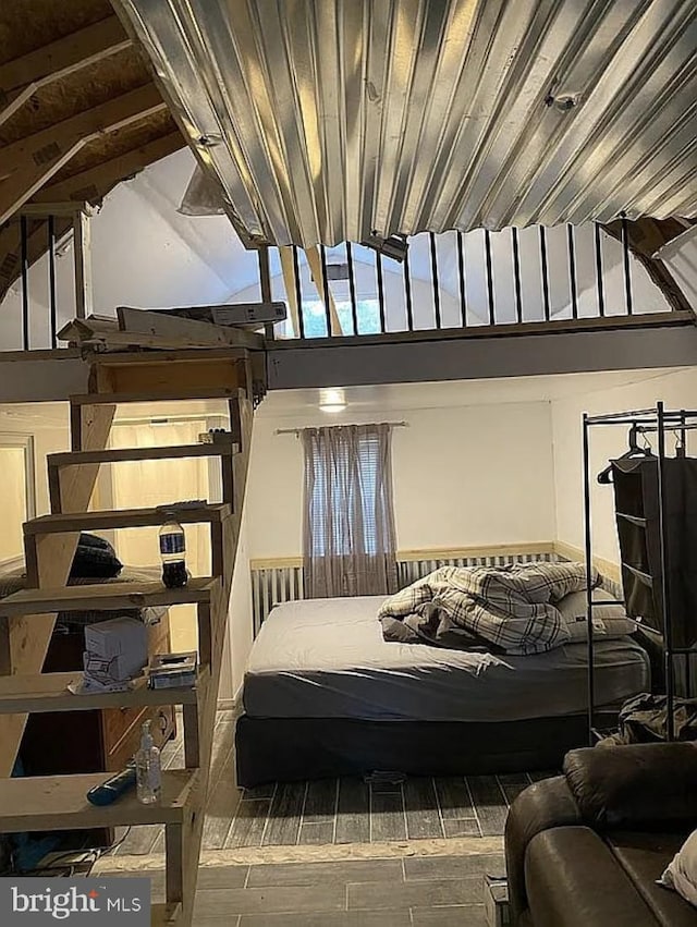 bedroom with wooden ceiling and wood finish floors