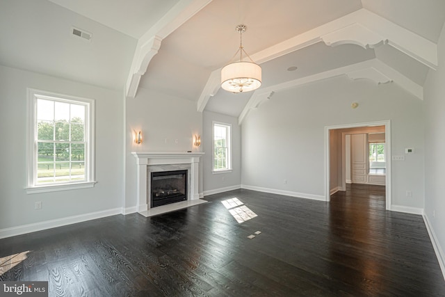 unfurnished living room featuring vaulted ceiling with beams, a premium fireplace, dark wood finished floors, and baseboards